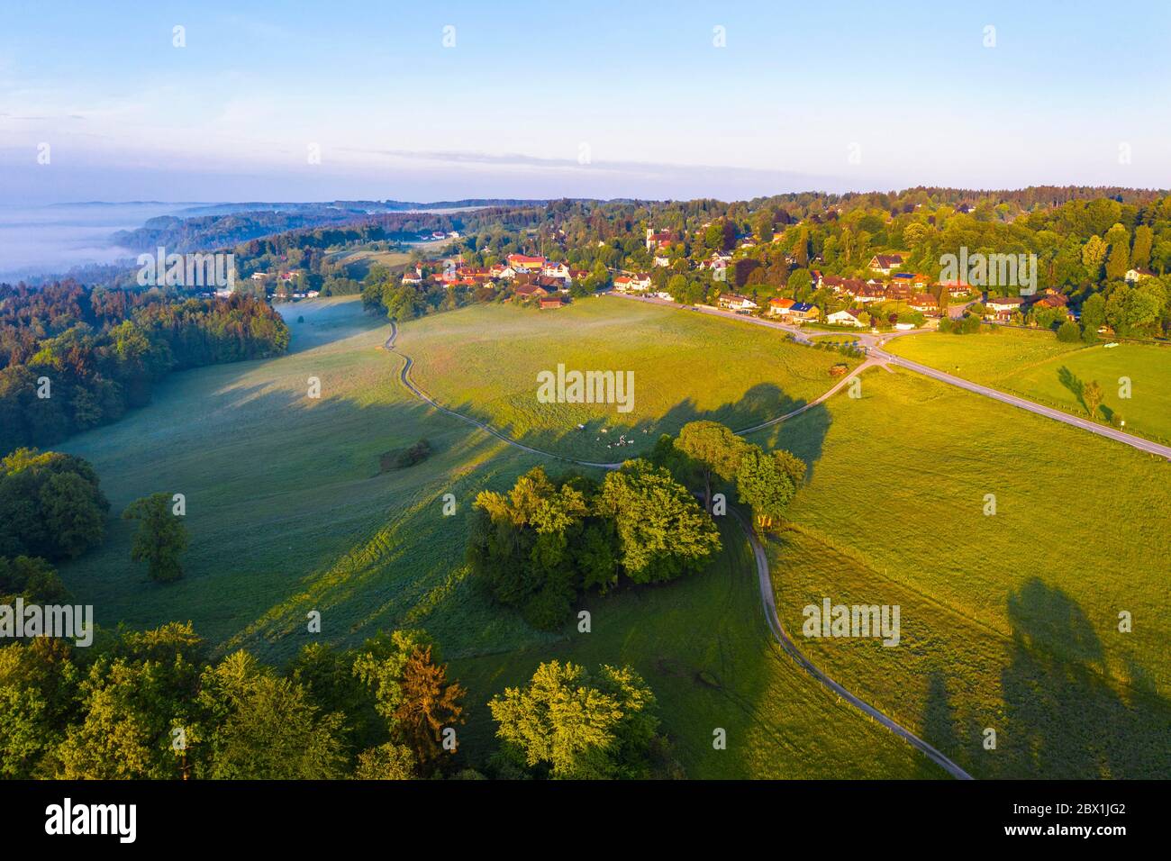 Meadow landscape in the morning light, Village Icking, Toelzer Land, drone shot, Upper Bavaria, Bavaria, Germany Stock Photo