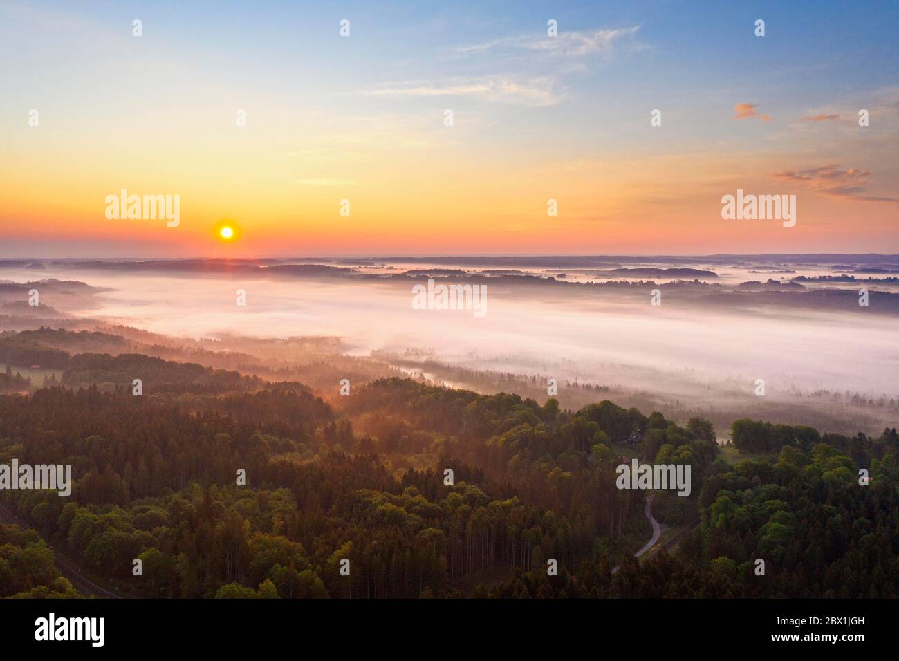 Fog over Isar valley at sunrise, near Icking, Toelzer Land, drone shot, Upper Bavaria, Bavaria, Germany Stock Photo