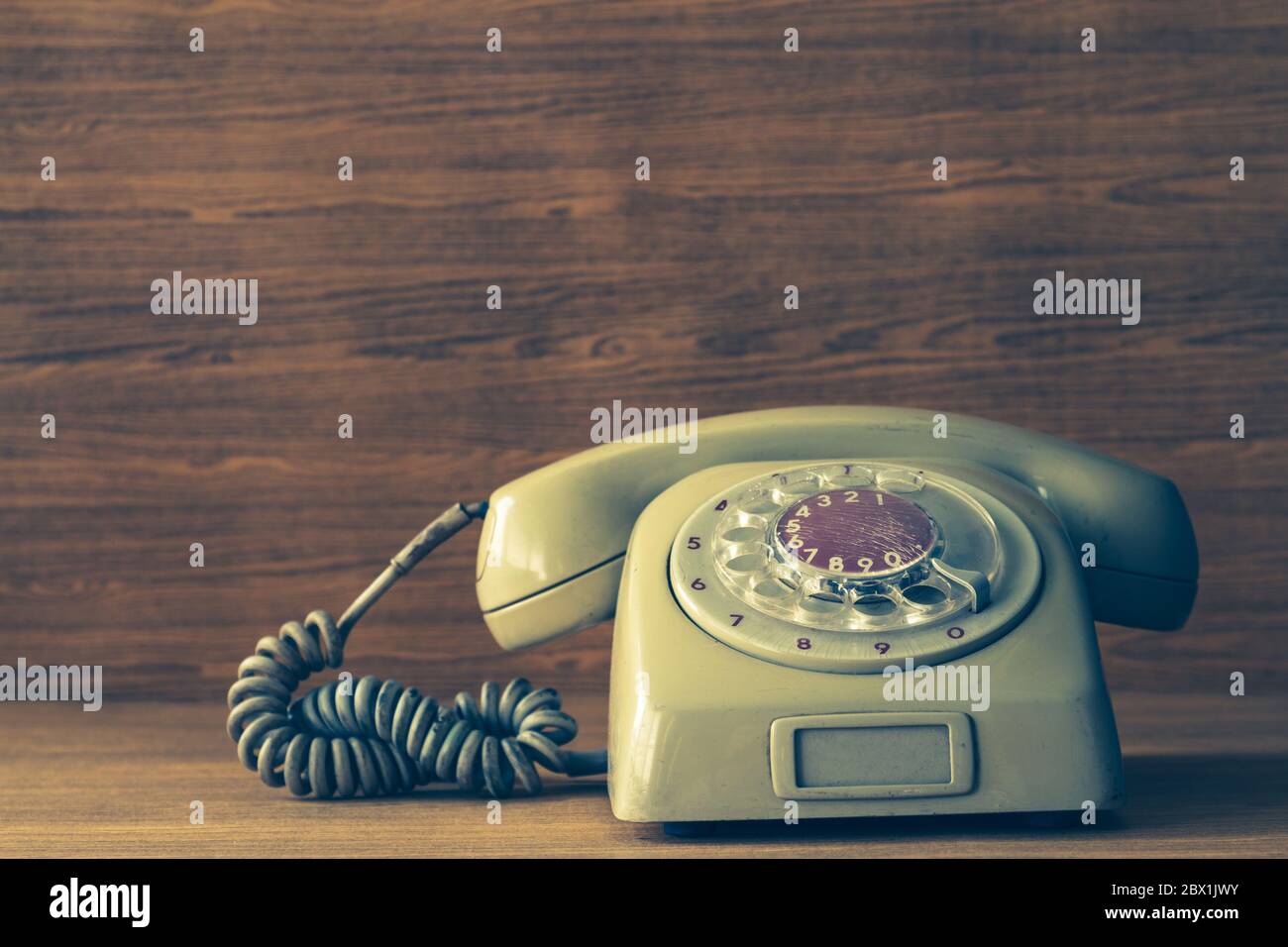 Old telephone on wooden hi-res stock photography and images - Alamy