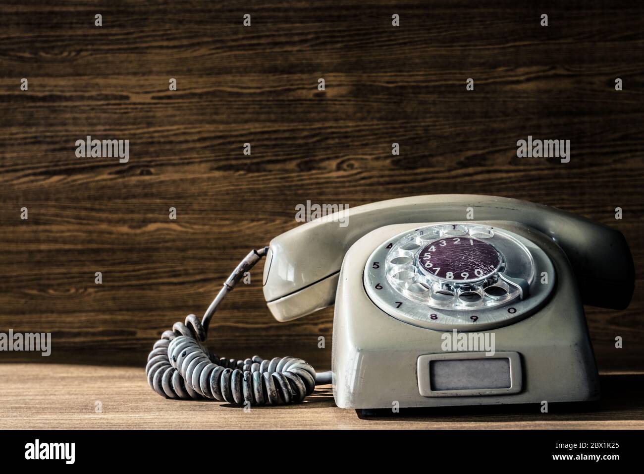 Old telephone on wooden table background Stock Photo - Alamy