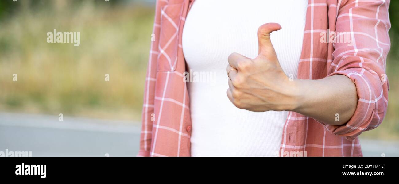 woman showing thumb up. hand with hyper flexible thumbs. Copy space Stock Photo