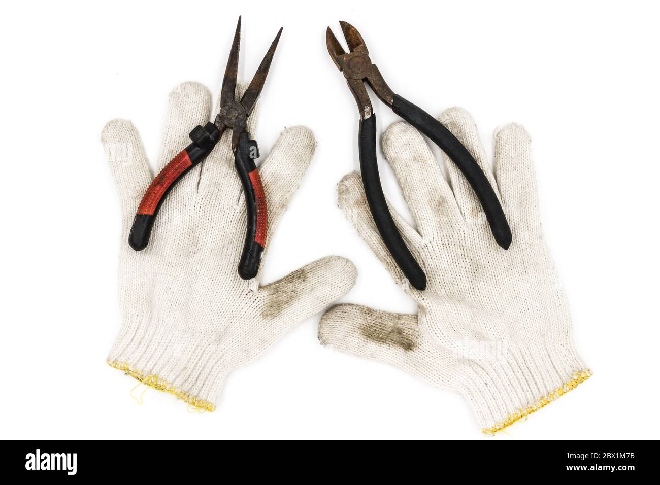 Old tools include gloves and pliers Stock Photo