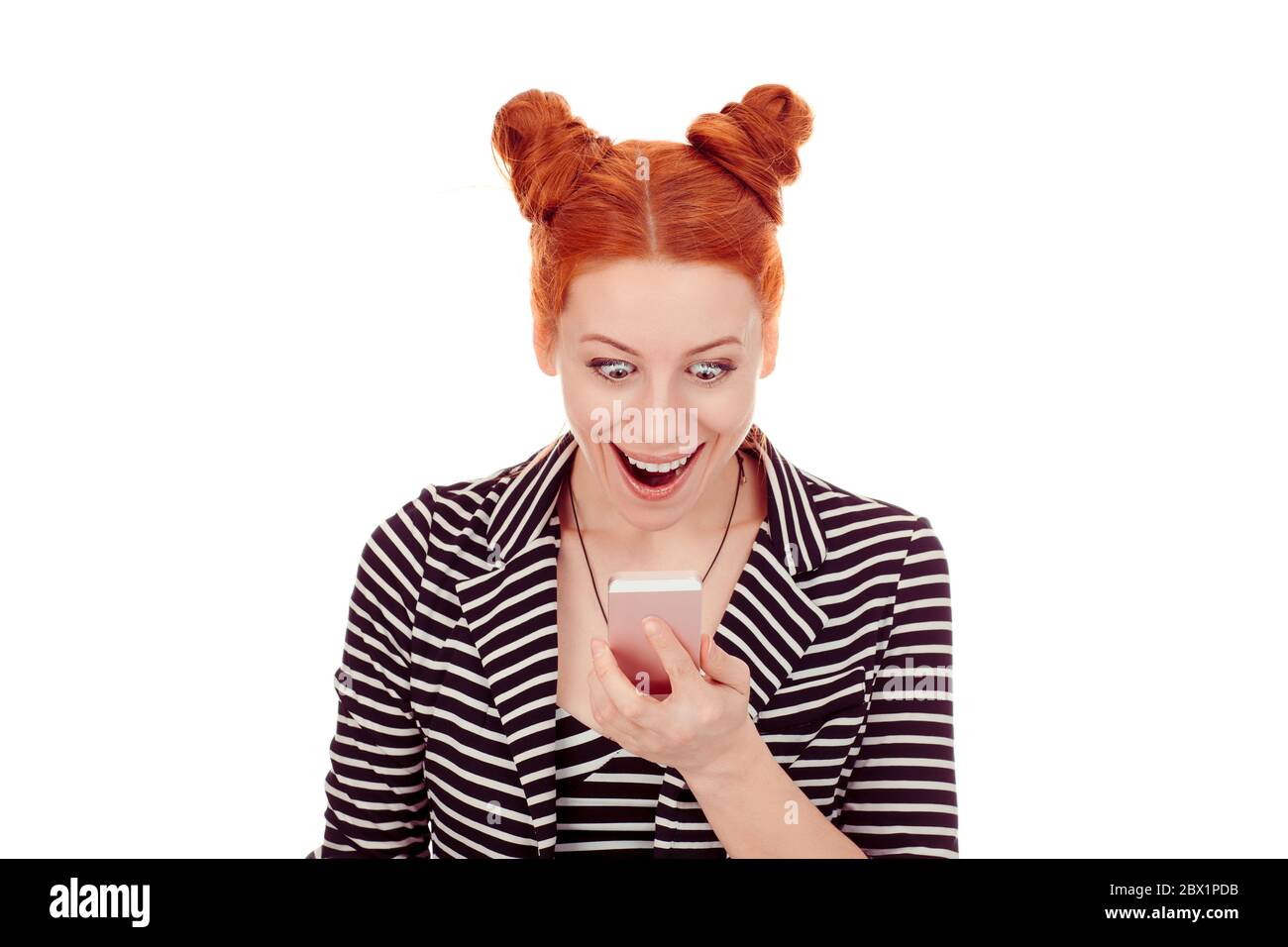 Great news. Closeup portrait cut out of beautiful Happy woman in her 30s  looking at smartphone super excited wearing striped black white jacket with Stock Photo