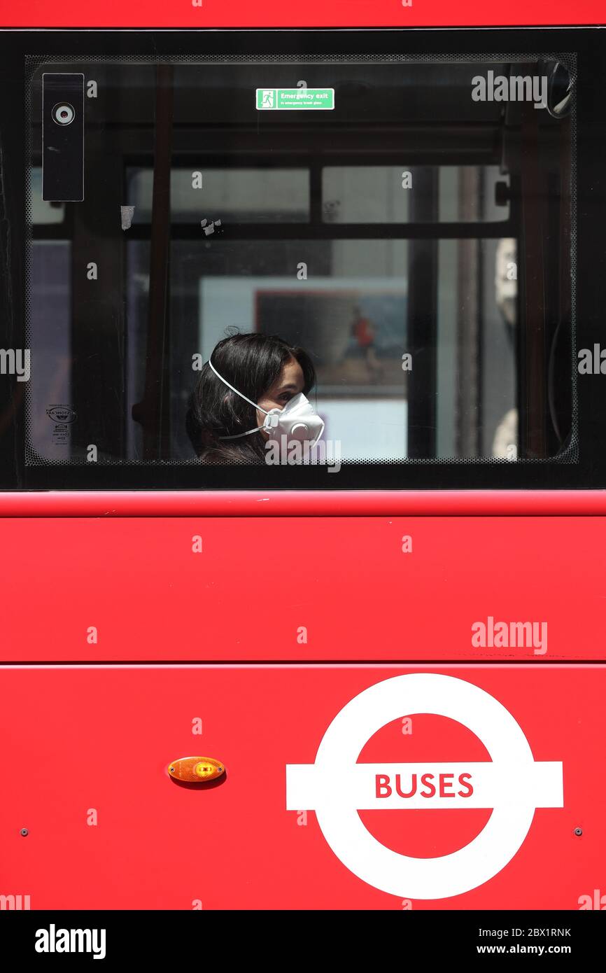 Wearing face mask bus on piccadilly hires stock photography and images