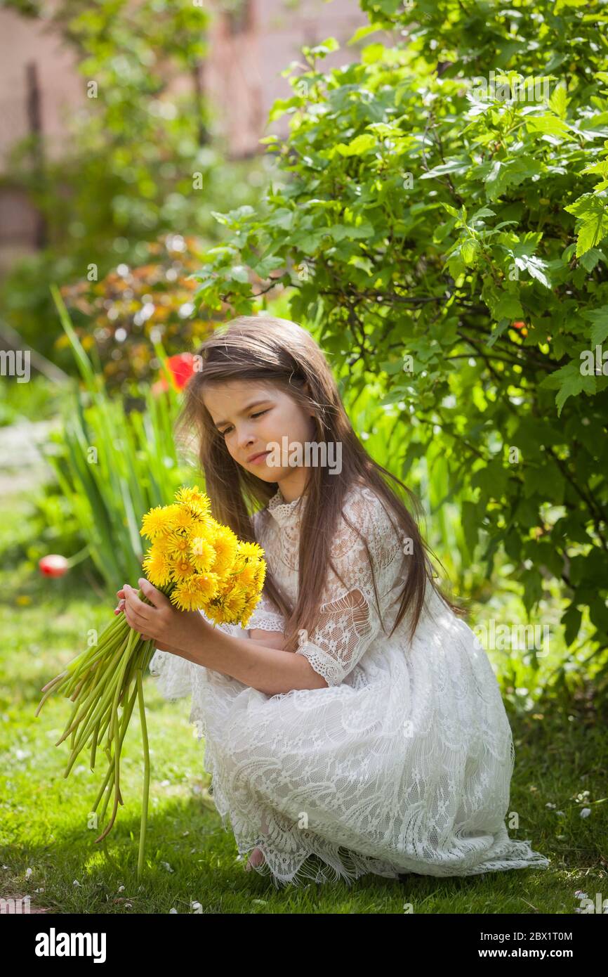 Free Photo | Sideways shot of young woman wears dress holds bouquet of  flowers gets it as present on 8 march poses against blue wall with copy  space for your promotion