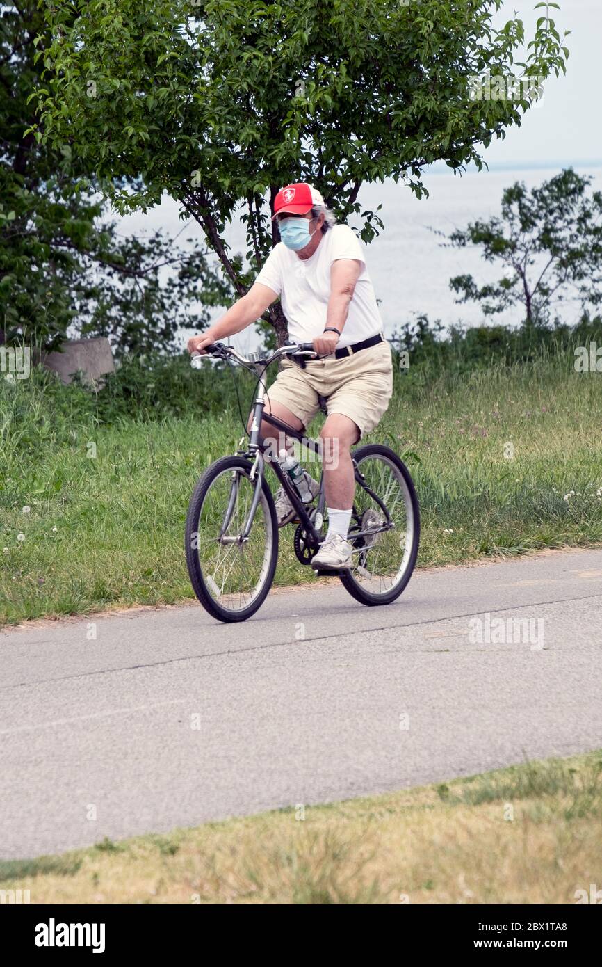 Riding bike with mask covid 19 nyc hi-res stock photography and images ...