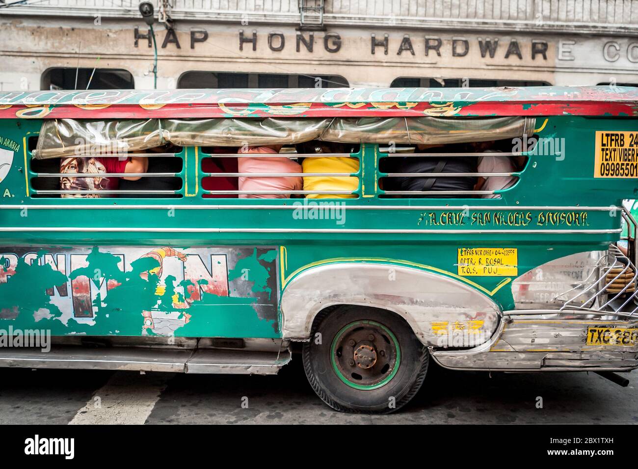 Traffic pauses at a busy junction in the China Town, Binondo District of Manila, The Philippines. Stock Photo