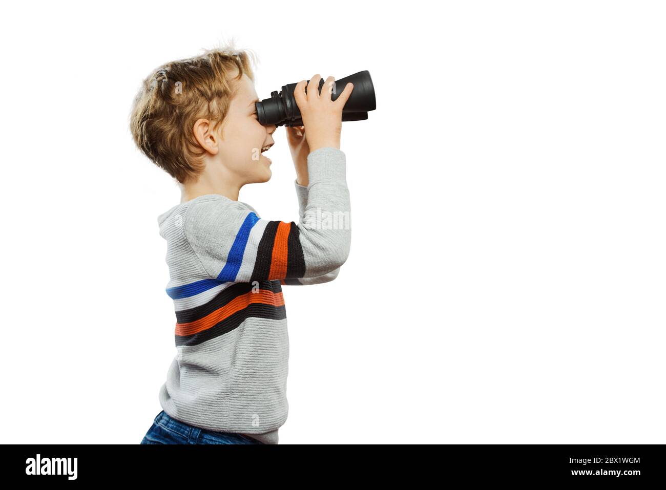 A child with binoculars discovers the world Stock Photo Alamy