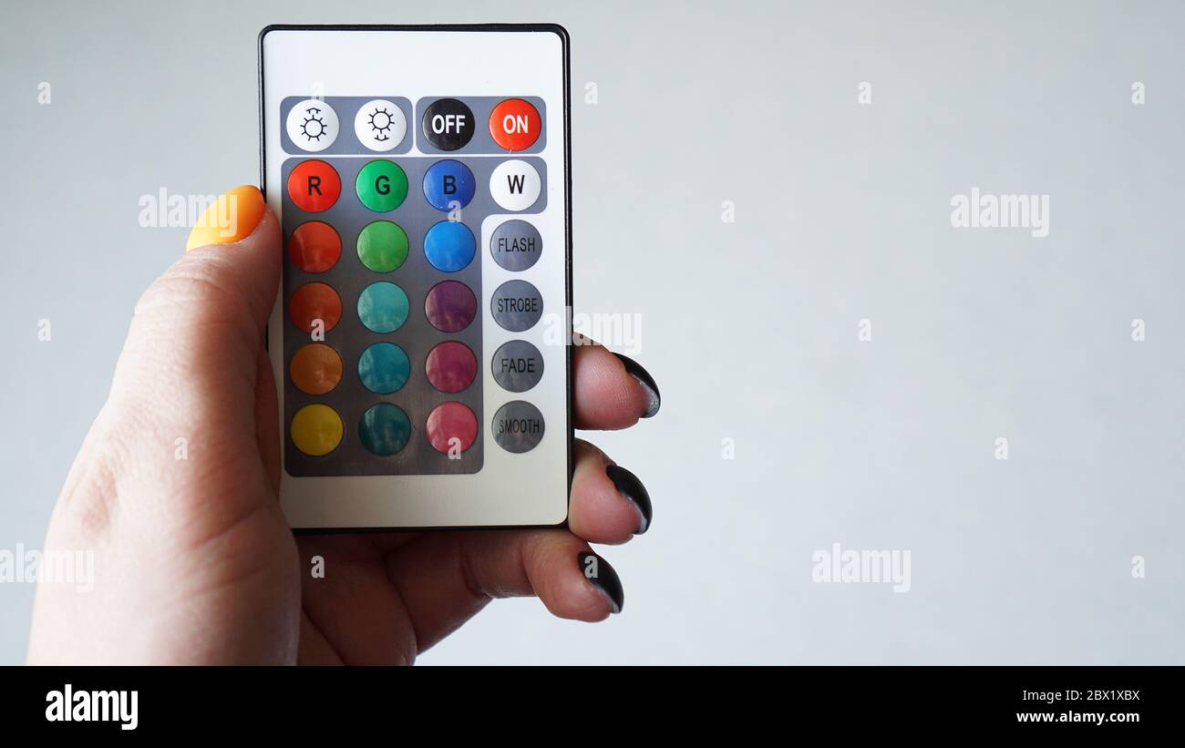 Remote control for change colors in hand isolated on white background ...