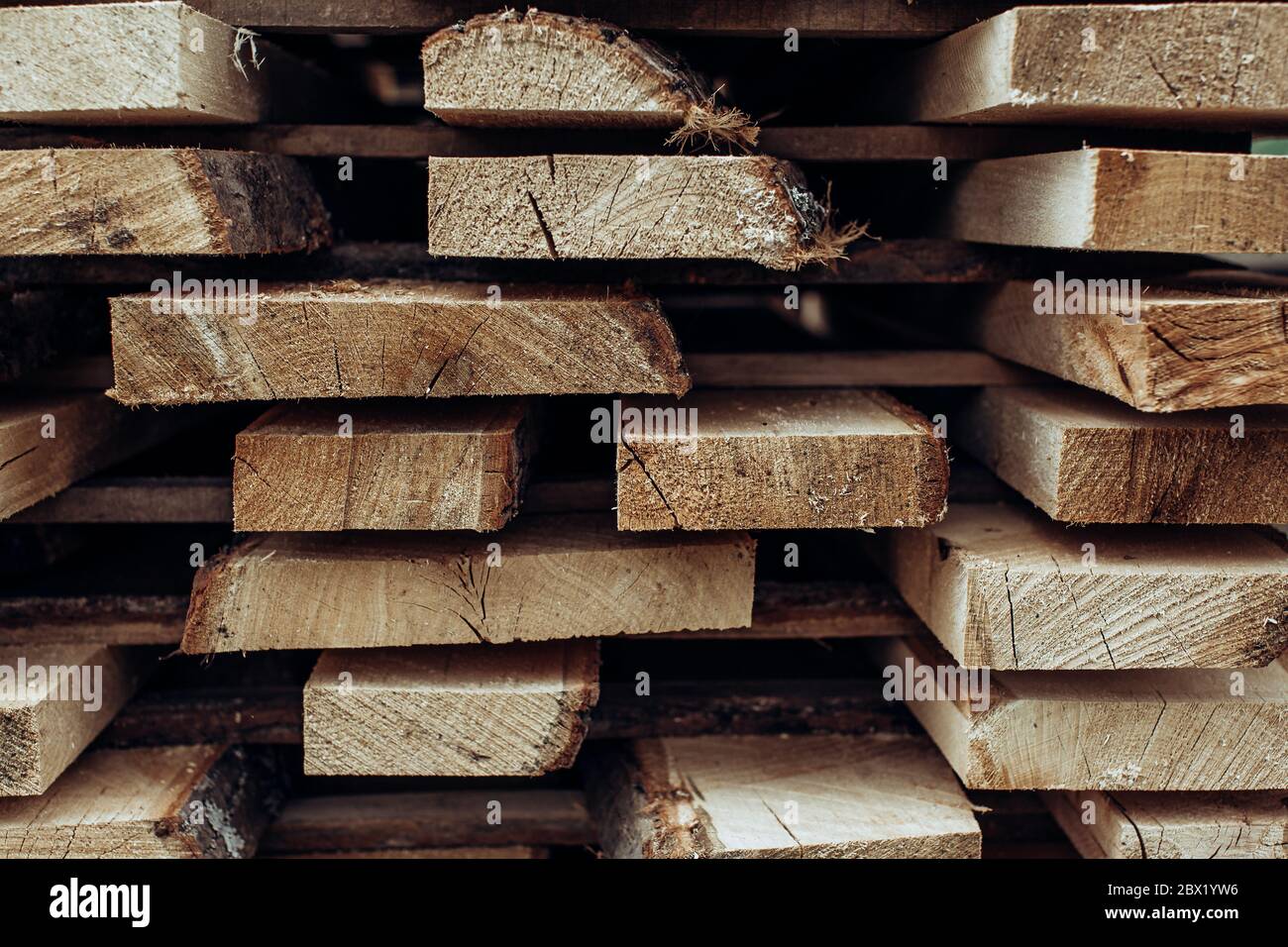 Piles of wooden boards in the sawmill, planking.  Stock Photo