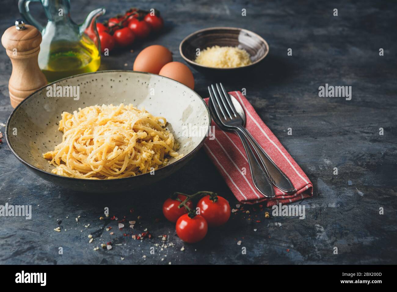 Pasta Linguine with scrambled eggs and parmesan cheese. Traditional