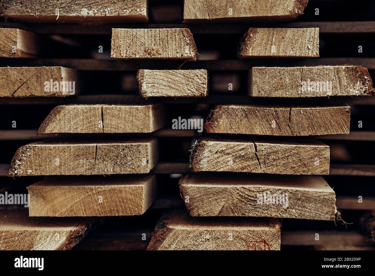 Wood factory stock . Piles of wooden boards in the sawmill, planking Stock Photo