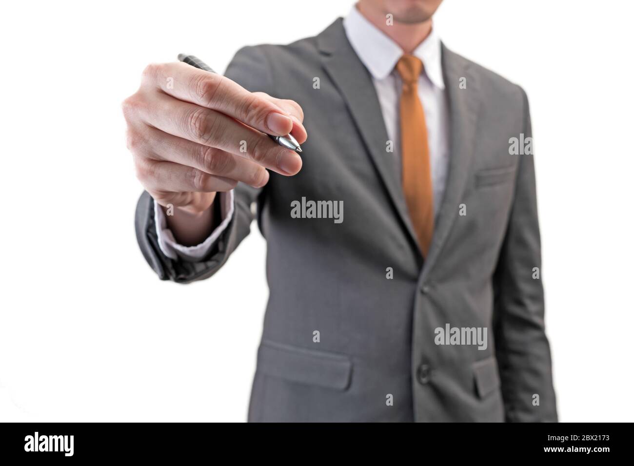 Businessman holding a pen isolated on white background Stock Photo - Alamy