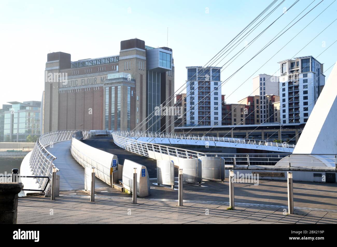 The Millennium Bridge in Newcastle upon Tyne also now as the Blinking Eye, with the Baltic Art Gallery in the background. Stock Photo