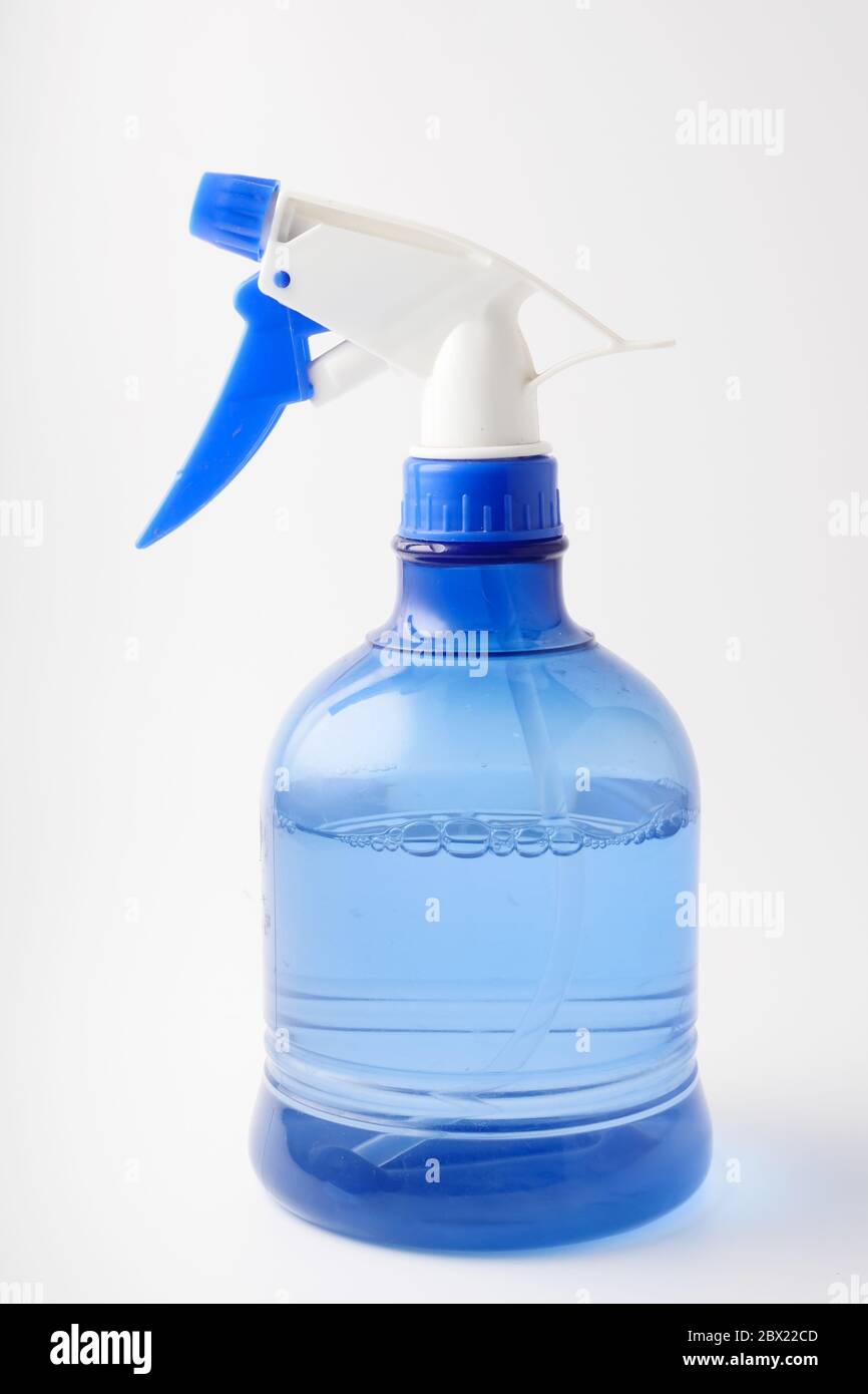 Spray bottle on a white background. Splashing water. Stock Photo