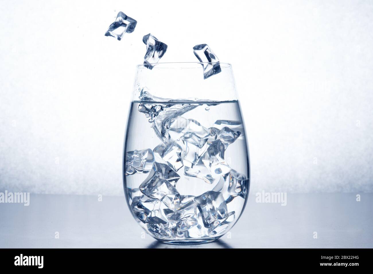 Glass of water with ice cubes Stock Photo - Alamy