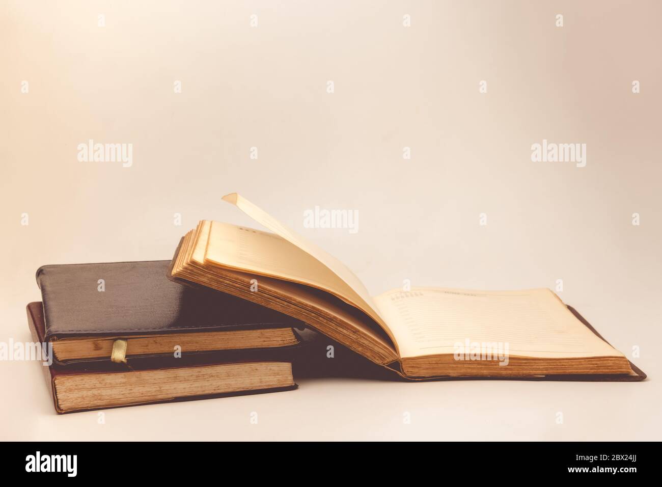 A stack of old books with vintage background Stock Photo - Alamy