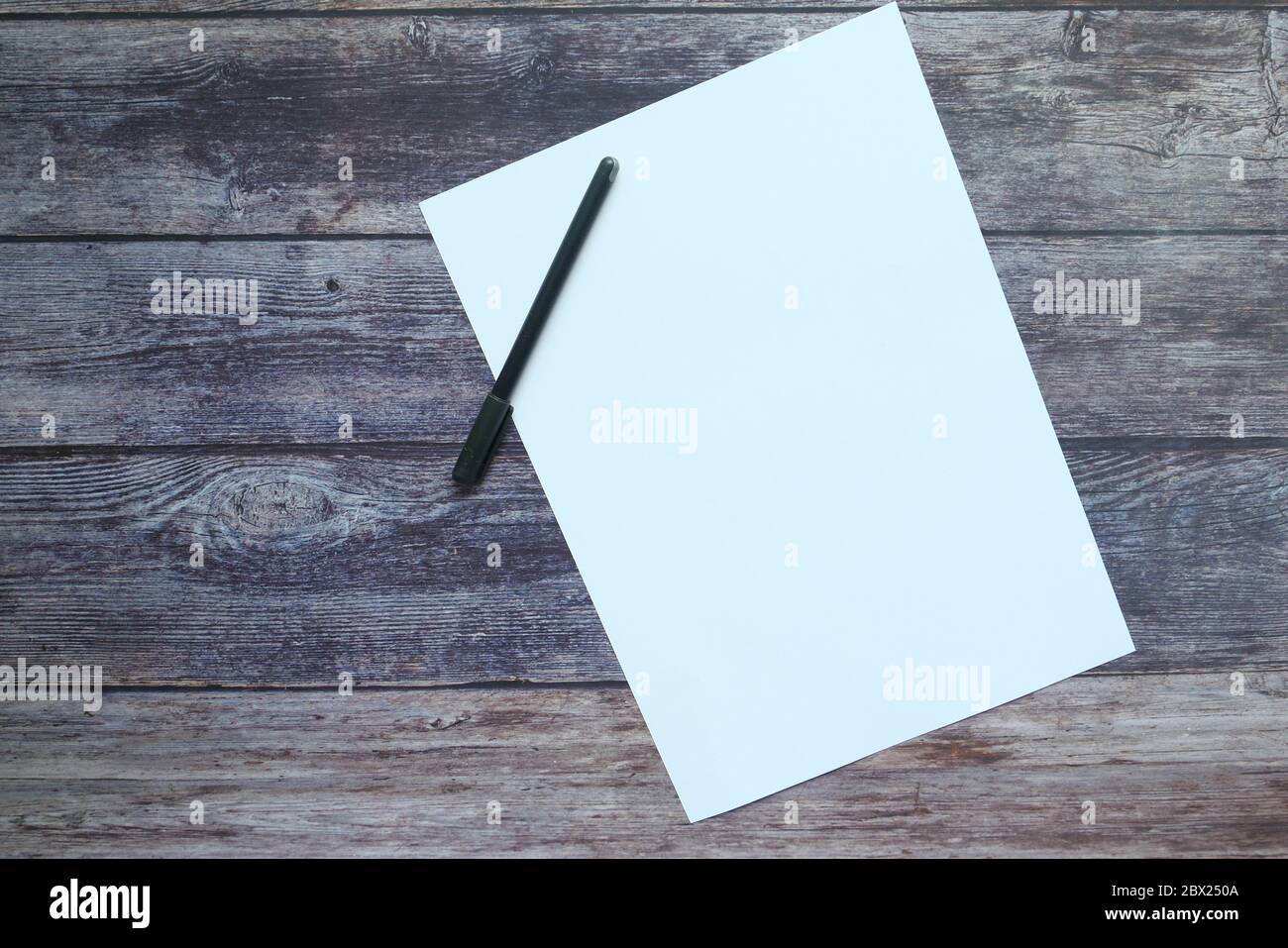 empty paper with pen on wooden background  Stock Photo