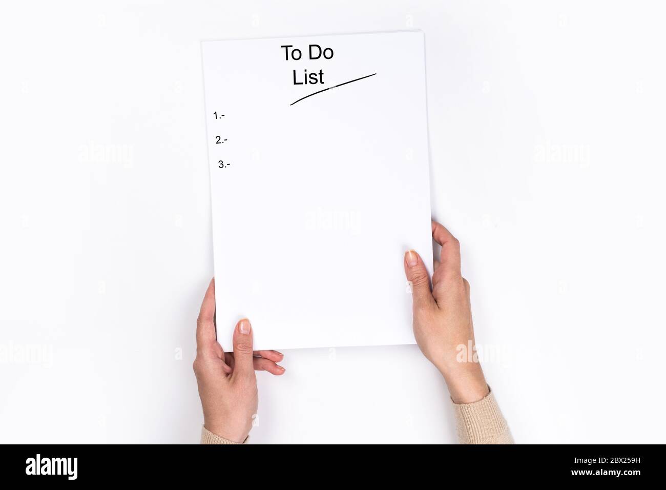 To do list Concept - 2020 number and text on notepad. Woman's hands ...