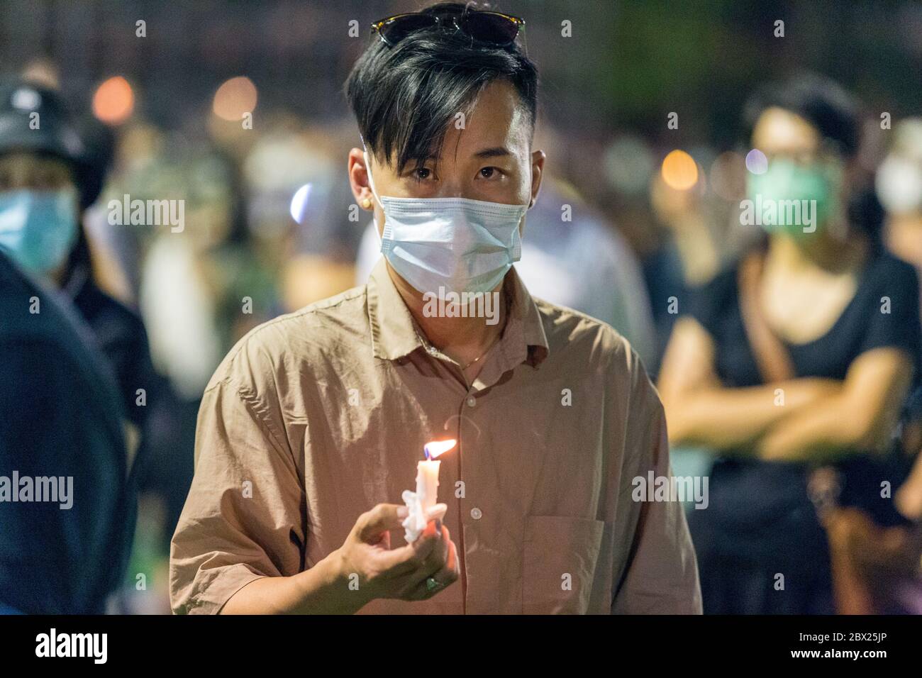 Hong Kong. 4 June, 2020  Hong Kongers defy police ban to gather for the annual Tiananmen vigil in Victoria Park. Credit: David Ogg / Alamy Live News Stock Photo