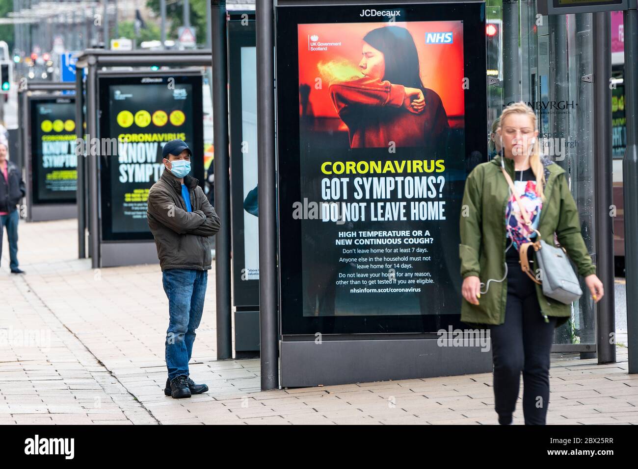 Edinburgh, Scotland, UK. 4 June 2020.  As Covid-19 lockdown relaxation continues in Scotland very few shops and businesses are open. Streets remain quiet and pubs and, with a few exceptions, bars and pubs are closed. Pictured; Coronavirus warning messages at bus stops on Princes Street. Iain Masterton/Alamy Live News Stock Photo