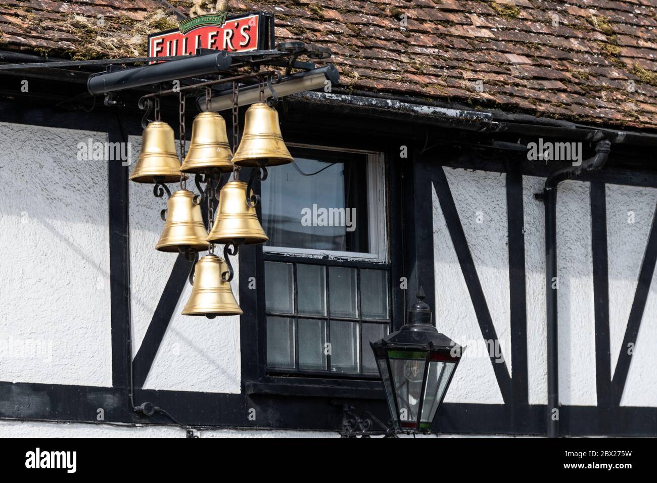 The Six Bells pub sign hanging outside the 16th century half-timbered framed public house in Lower High street in the market town of Thames in Oxfords Stock Photo