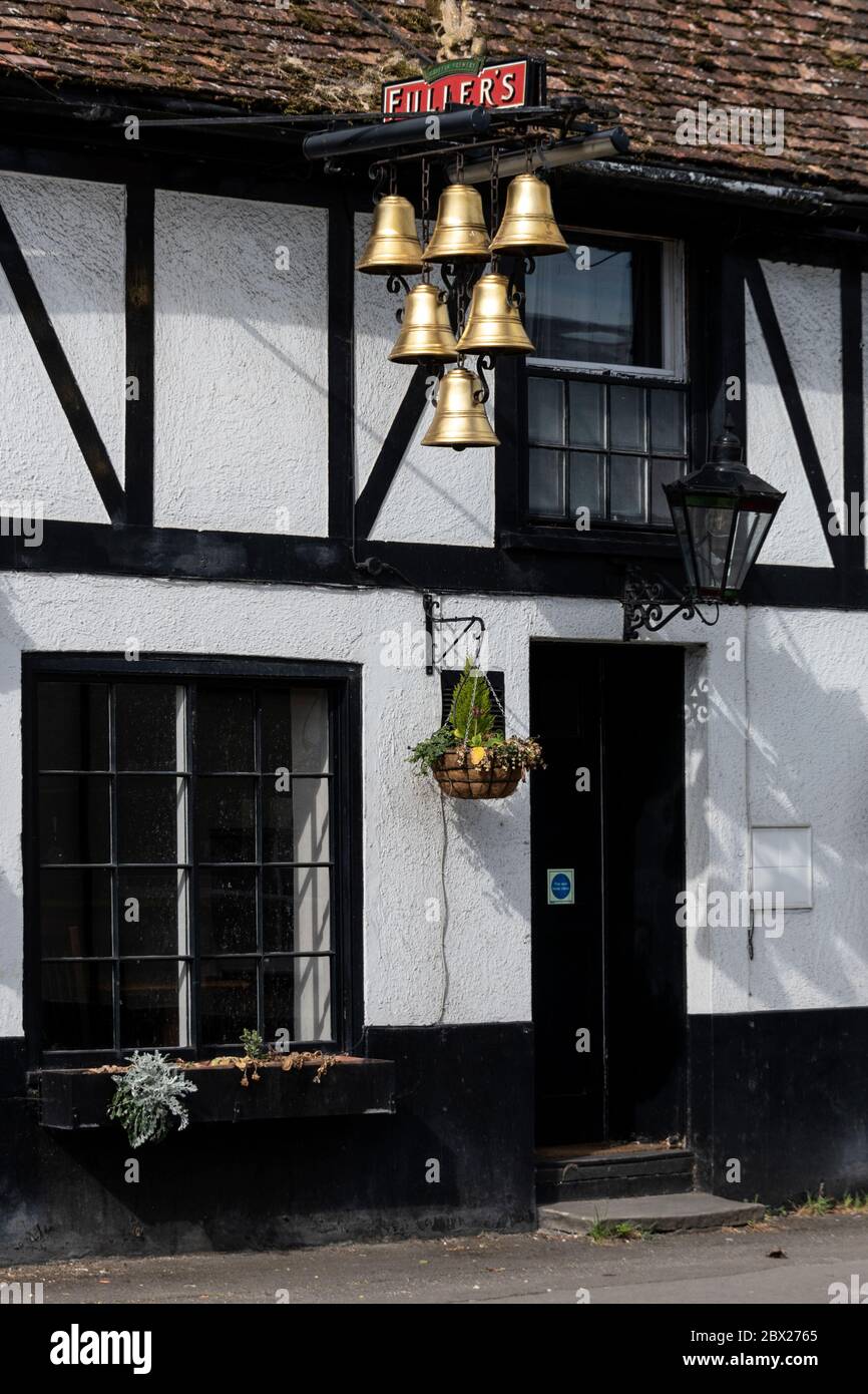 The Six Bells pub sign hanging outside the 16th century half-timbered framed public house in Lower High street in the market town of Thames in Oxfords Stock Photo