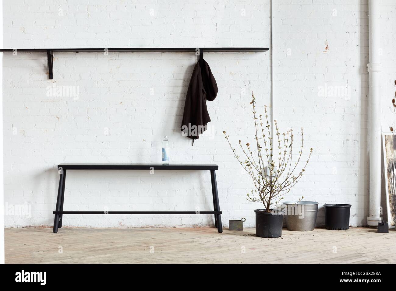 Bench, shelf, coatrack in industrial space Stock Photo