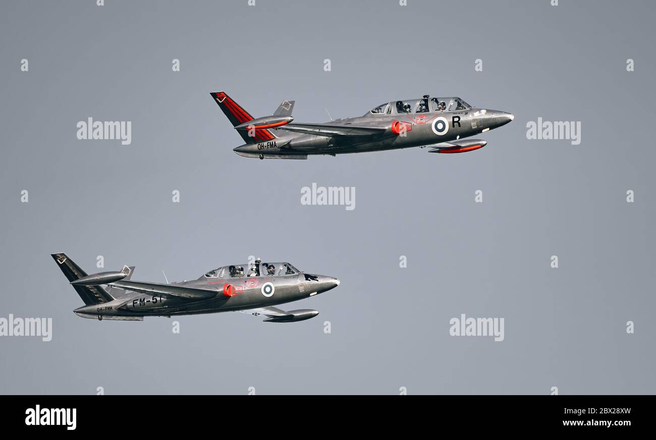 Helsinki, Finland - 9 June 2017: Two Silver Jets Aerobatic Team Fouga CM 170 Magister jets flying at the Kaivopuisto Air Show in Helsinki, Finland. Stock Photo