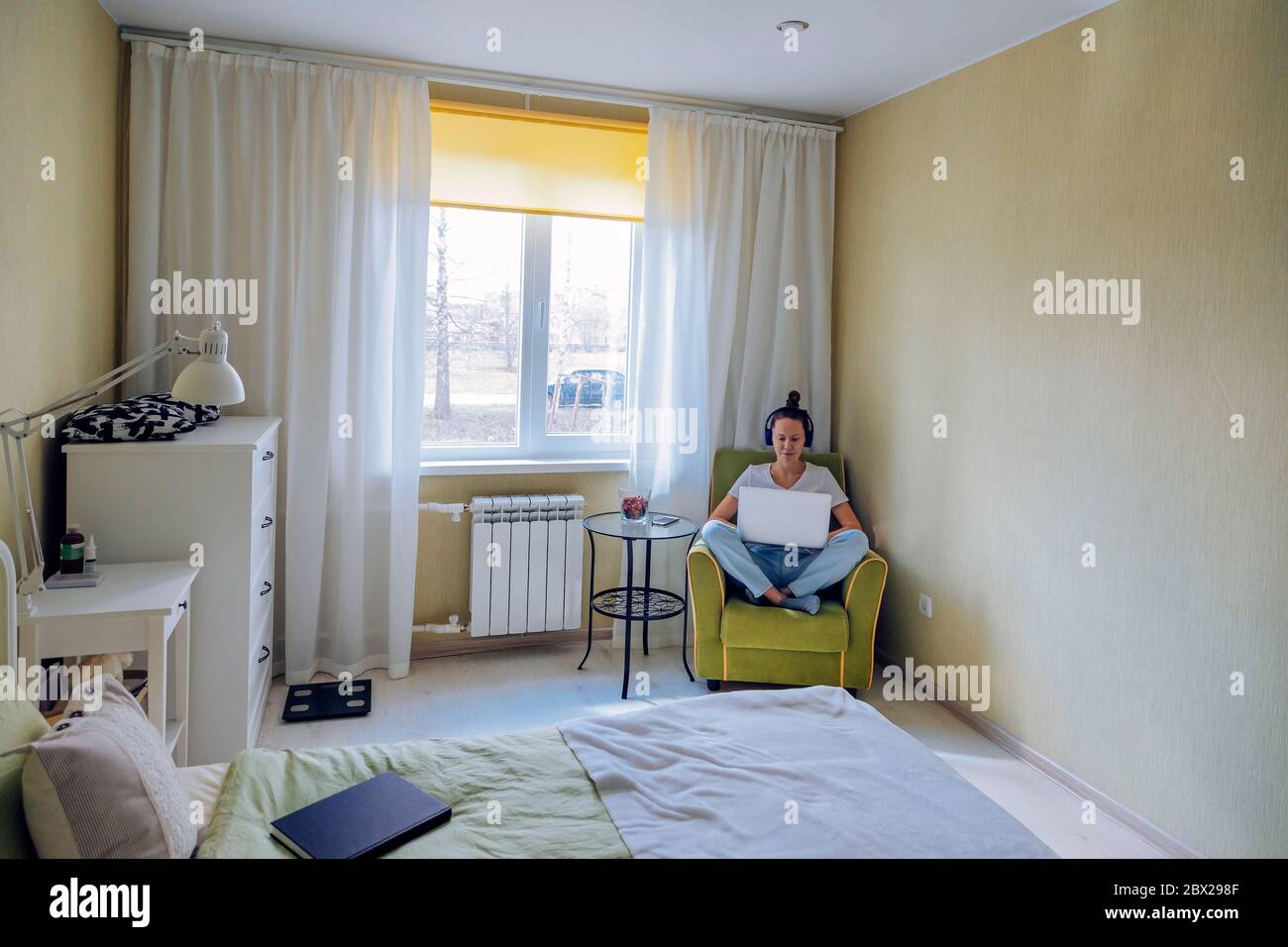 Young woman sitting chair hi-res stock photography and images - Alamy
