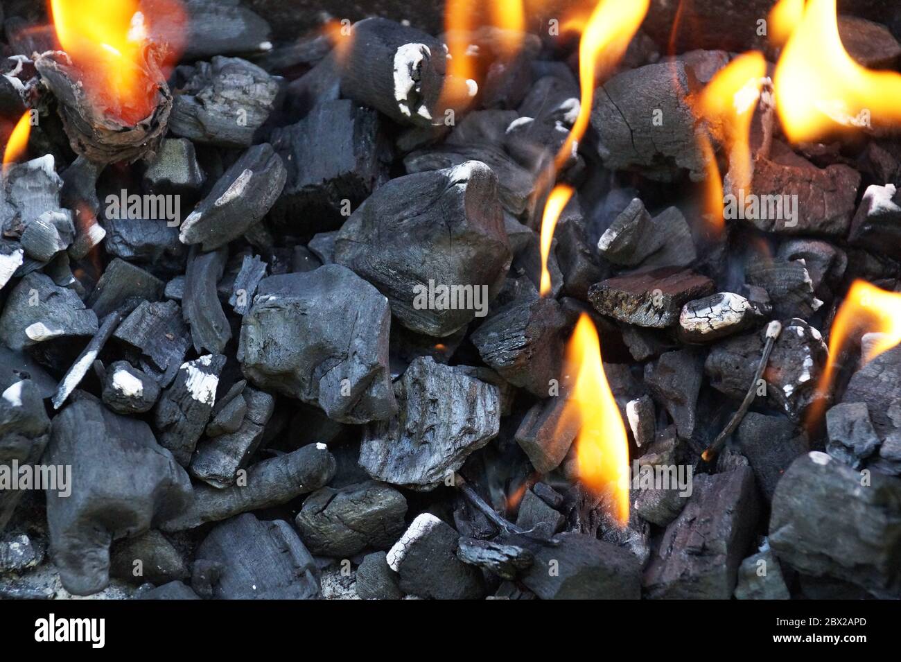 Lighting fire in the grill. Charcoal during lighting up Stock Photo Alamy