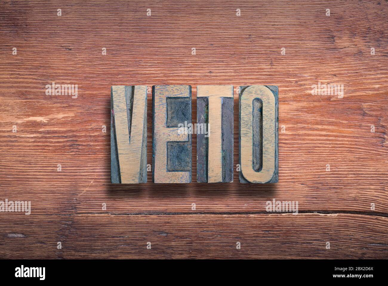 veto ancient Latin word meaning - I forbid, combined on vintage varnished wooden surface Stock Photo