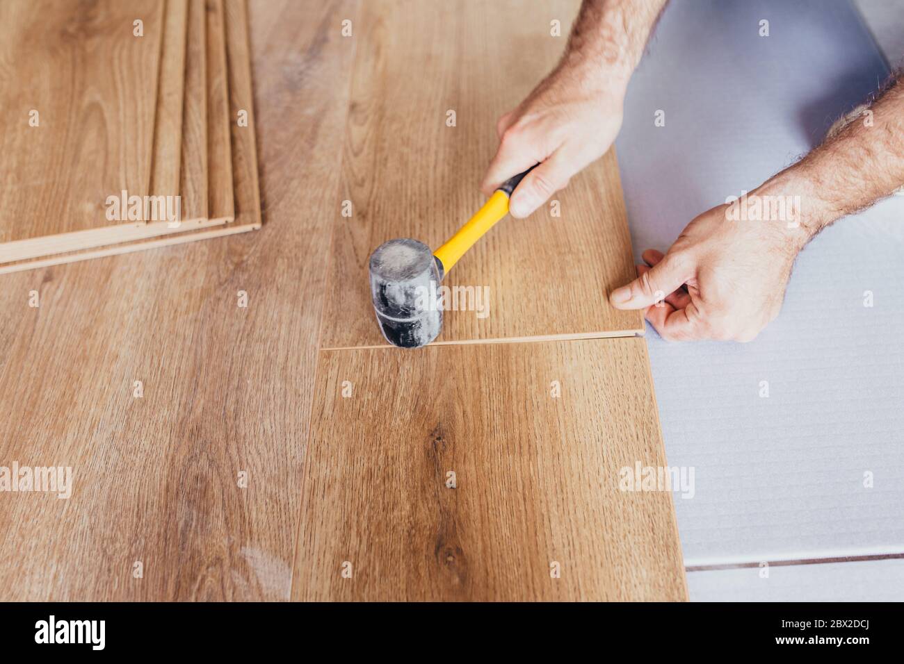 Fixing the plastic "lock" lock with a rubber mallet The sequence of