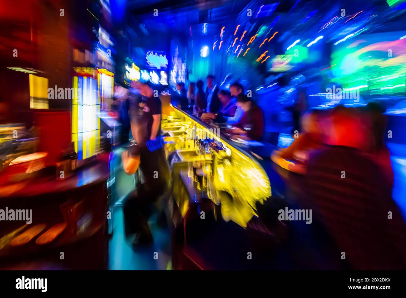 People have fun at bar drinking alcohol Stock Photo - Alamy
