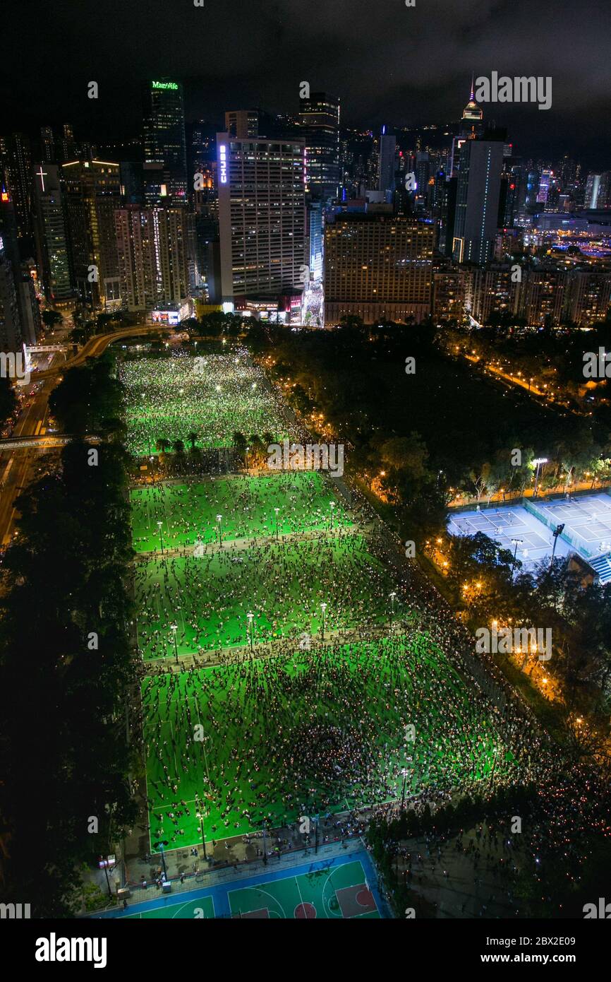 An overview of thousands of citizens gathered at Victoria Park. Thousands of Hong Kong People defy the public gathering ban imposed by government following the Coronavirus (COVID-19) crisis situation and gather at Victoria Park for Tiananmen Anniversary. Stock Photo