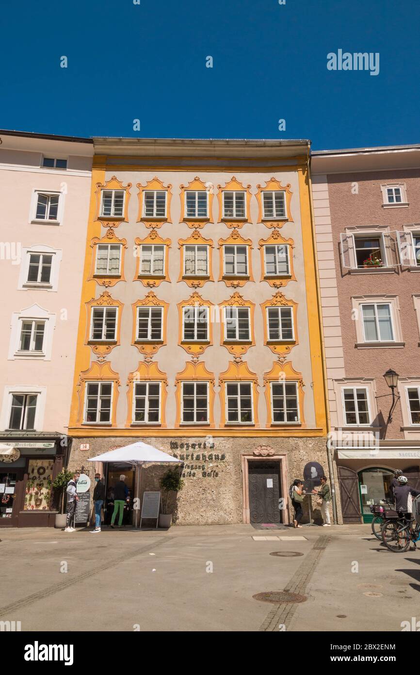 Salzburg, Austria - May 7, 2020: Birthplace house of  Wolfgang Amadeus Mozart in the old town of Salzburg, view from Universitatsplatz (University squ Stock Photo