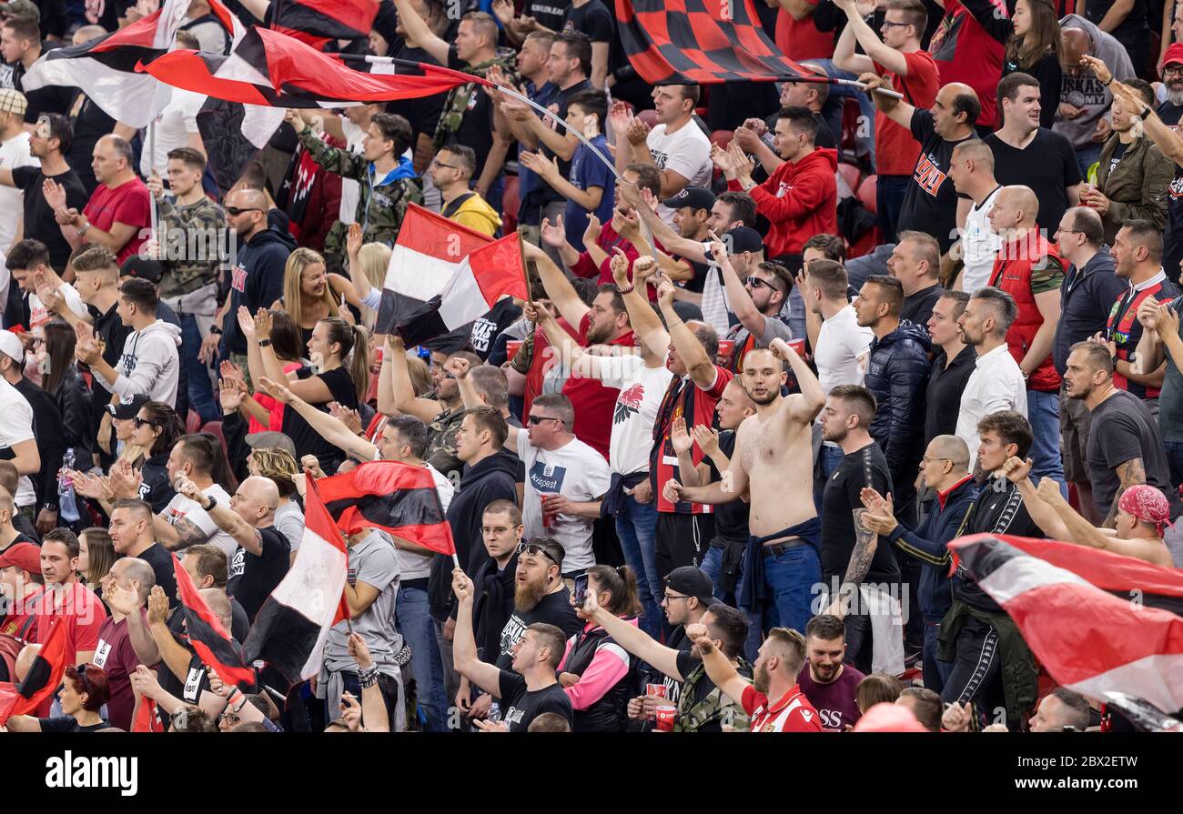 BUDAPEST, HUNGARY - JUNE 3: Ultras of Budapest Honved (as known as Puskas Army) flutter flags during the Hungarian Cup Final match between Budapest Honved and Mezokovesd Zsory FC at Puskas Arena on June 3, 2020 in Budapest, Hungary. Stock Photo