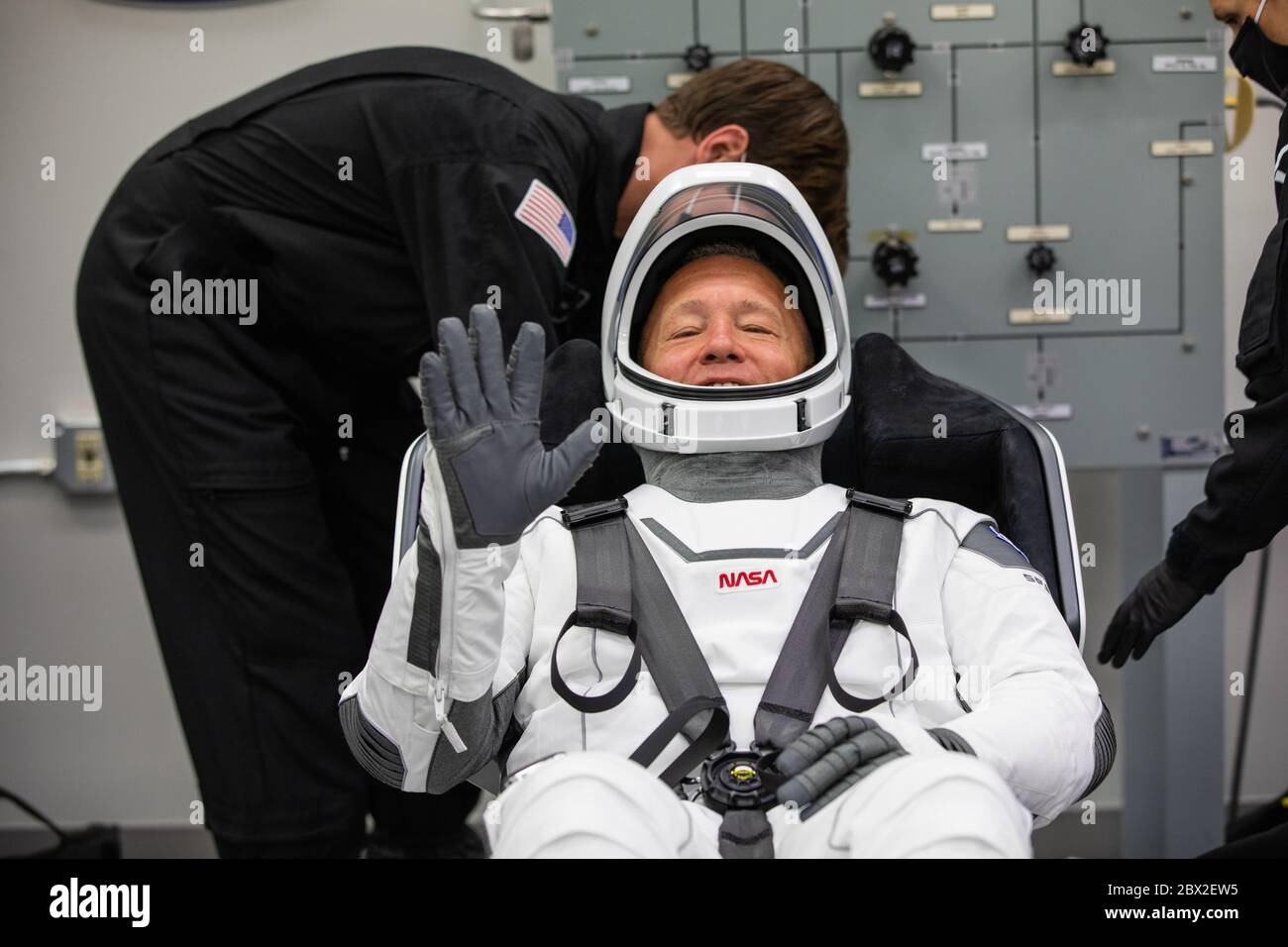 NASA astronaut Douglas Hurley, smiles as he suits-up in his SpaceX spacesuit, in the ready room of the Neil Armstrong Operations and Checkout Building at the Kennedy Space Center May 30, 2020 Cape Canaveral, in Florida. The astronauts Behnken and Hurley will make a second attempt at launch in the first commercial launch carrying astronauts to the International Space Station. Stock Photo
