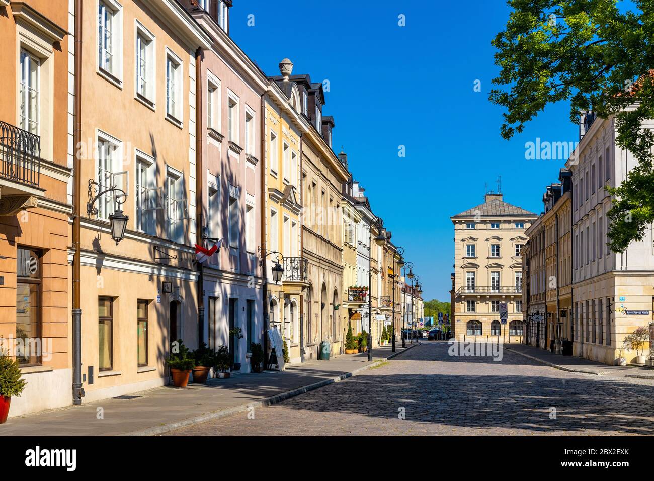Warsaw, Mazovia / Poland - 2020/05/10: Colorful renovated tenement houses of historic New Town quarter - Nowe Miasto - along Freta street Stock Photo