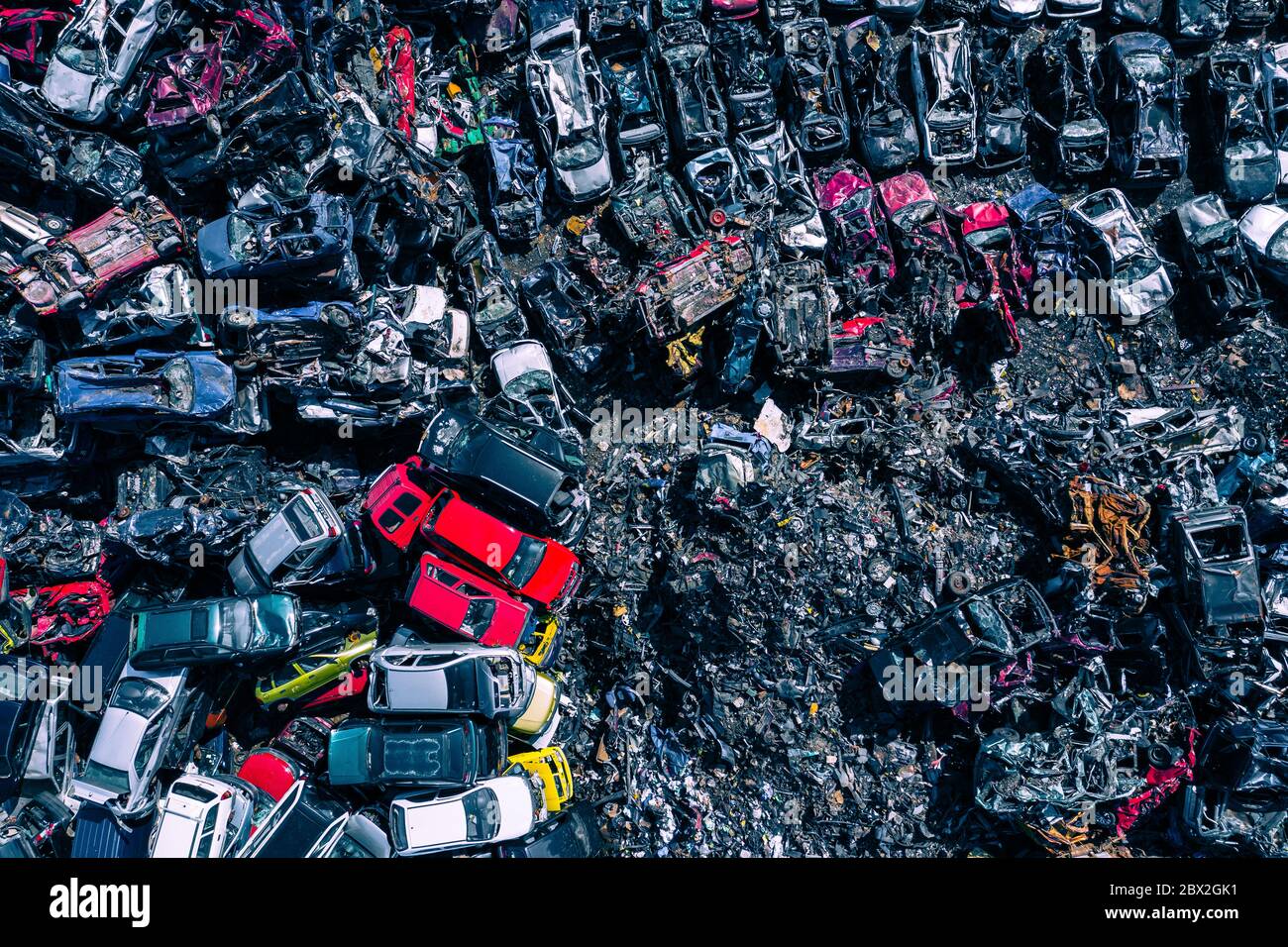Scrapyard Aerial View. Old rusty corroded cars in car junkyard. Car recycling industry from above. Stock Photo