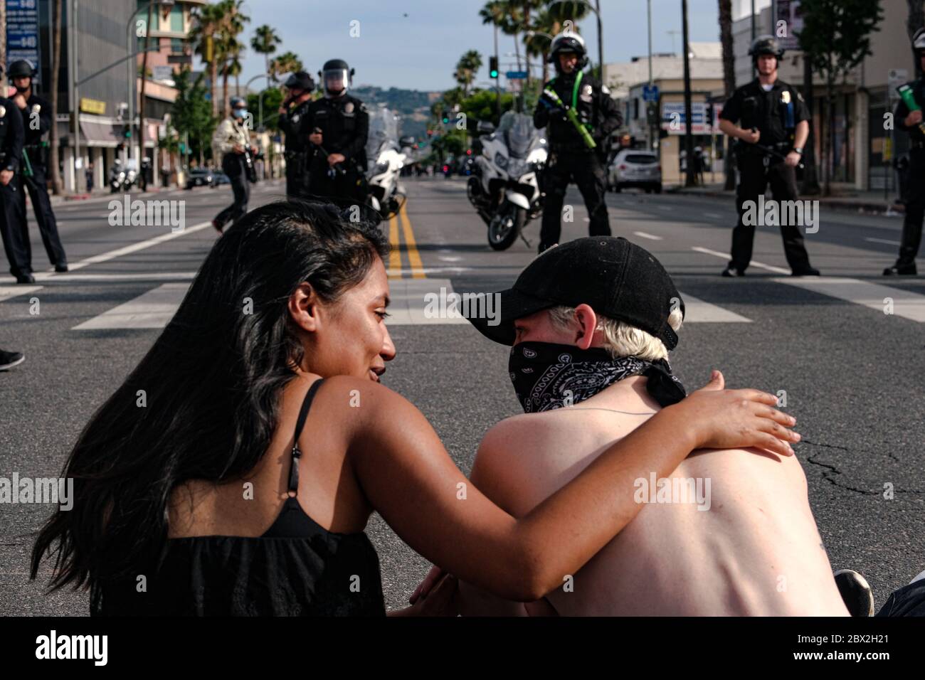 Los Angeles, California, USA. 1st June, 2020. Protestors gather in Van Nuys, during a 'Black Lives Matter' demonstration as police patrol the area. Protests erupted around the nation after George Floyd was killed in police custody in Minneapolis. Credit: Jason Ryan/ZUMA Wire/Alamy Live News Stock Photo