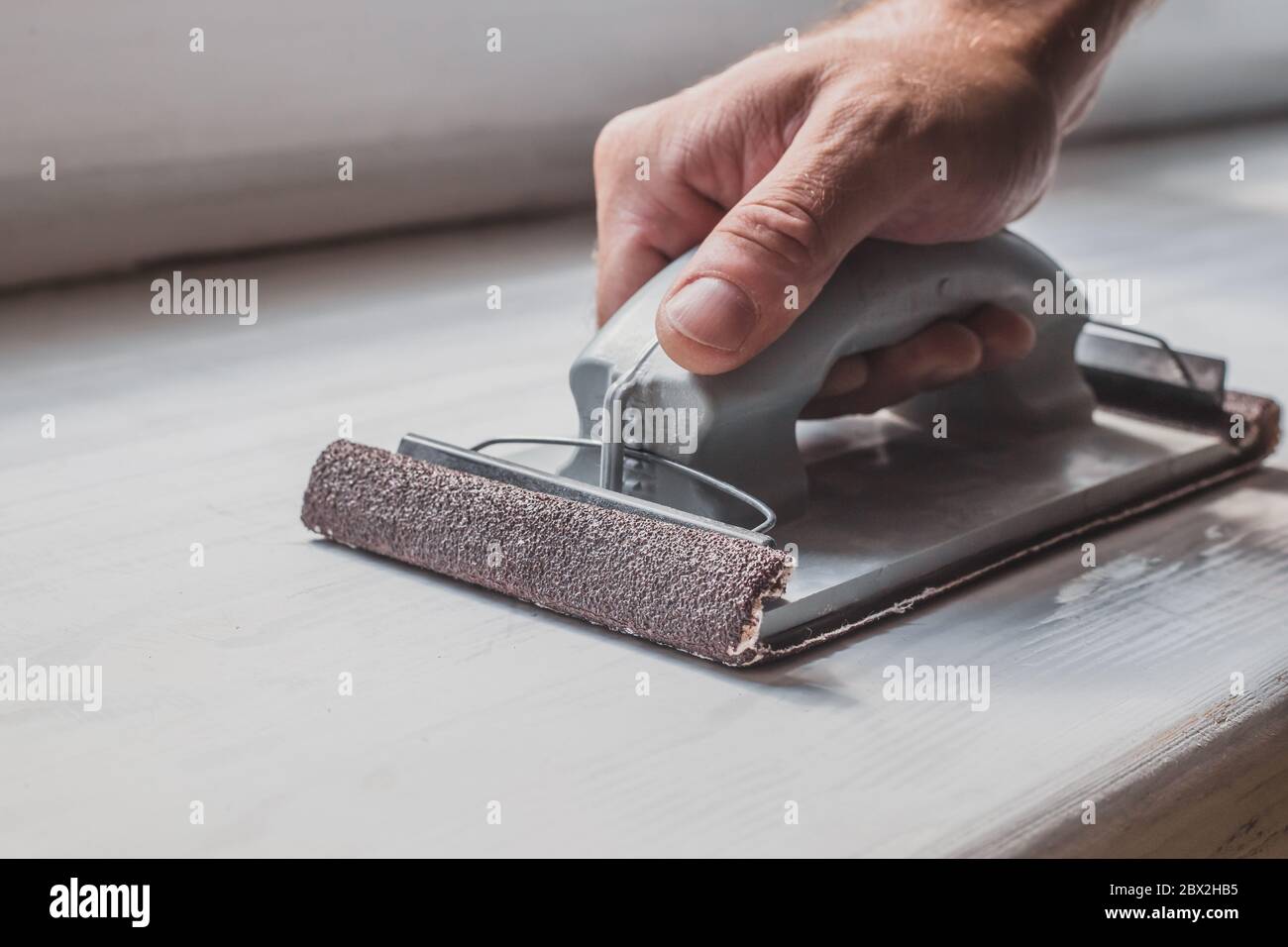 Rough surface treatment sanding with coarse sandpaper Stock Photo Alamy