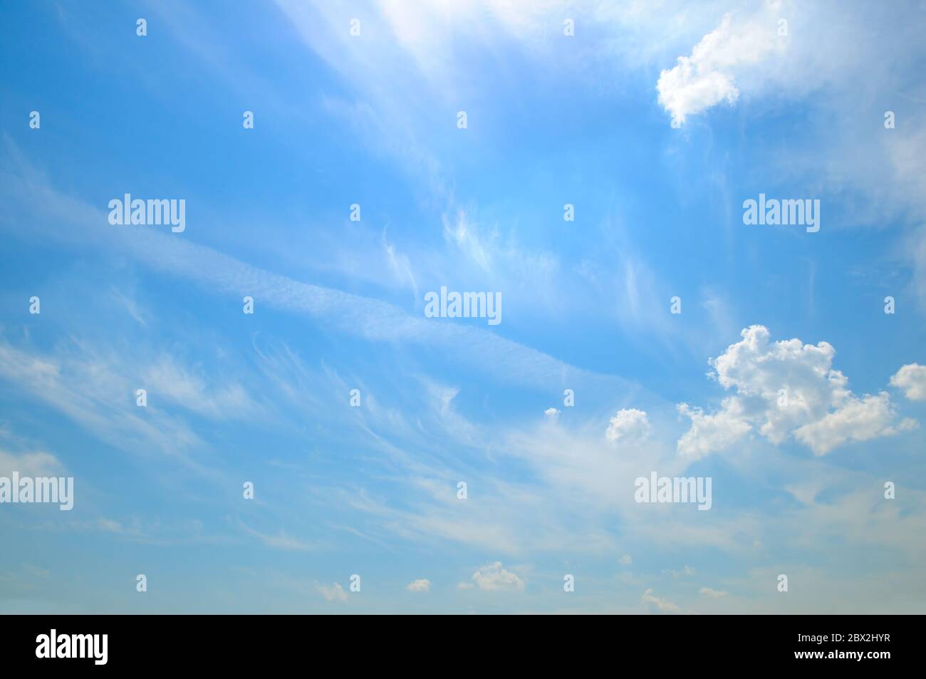 light cumulus clouds in the blue sky Stock Photo - Alamy