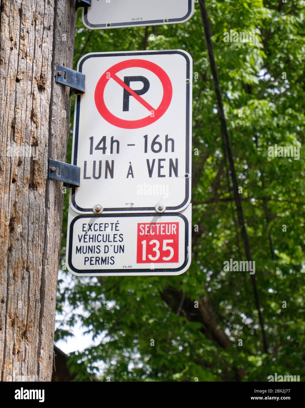 Montreal street no parking sign with exceptions for Local permit owners Stock Photo