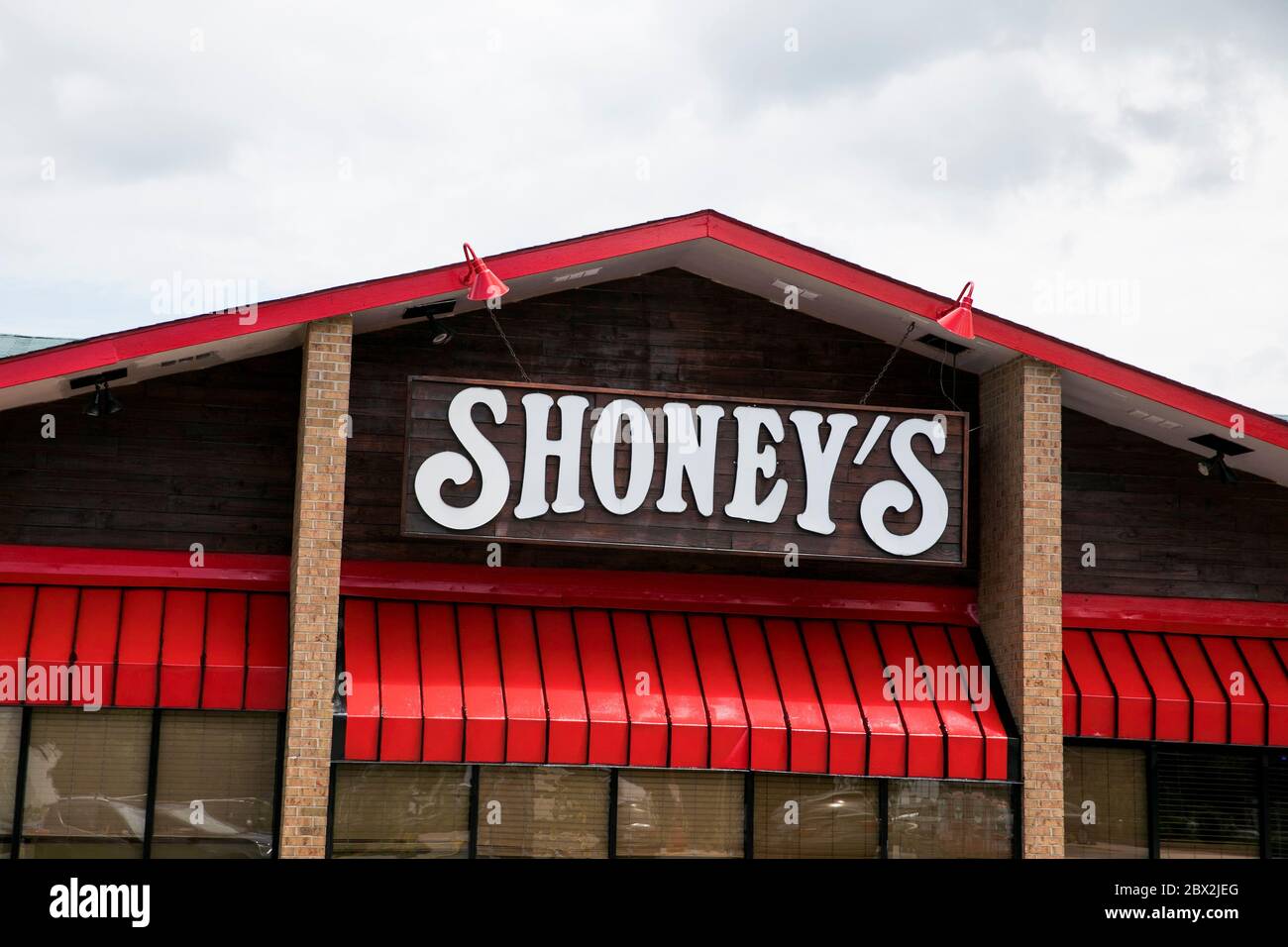 A logo sign outside of a Shoney's restaurant location in Charleston
