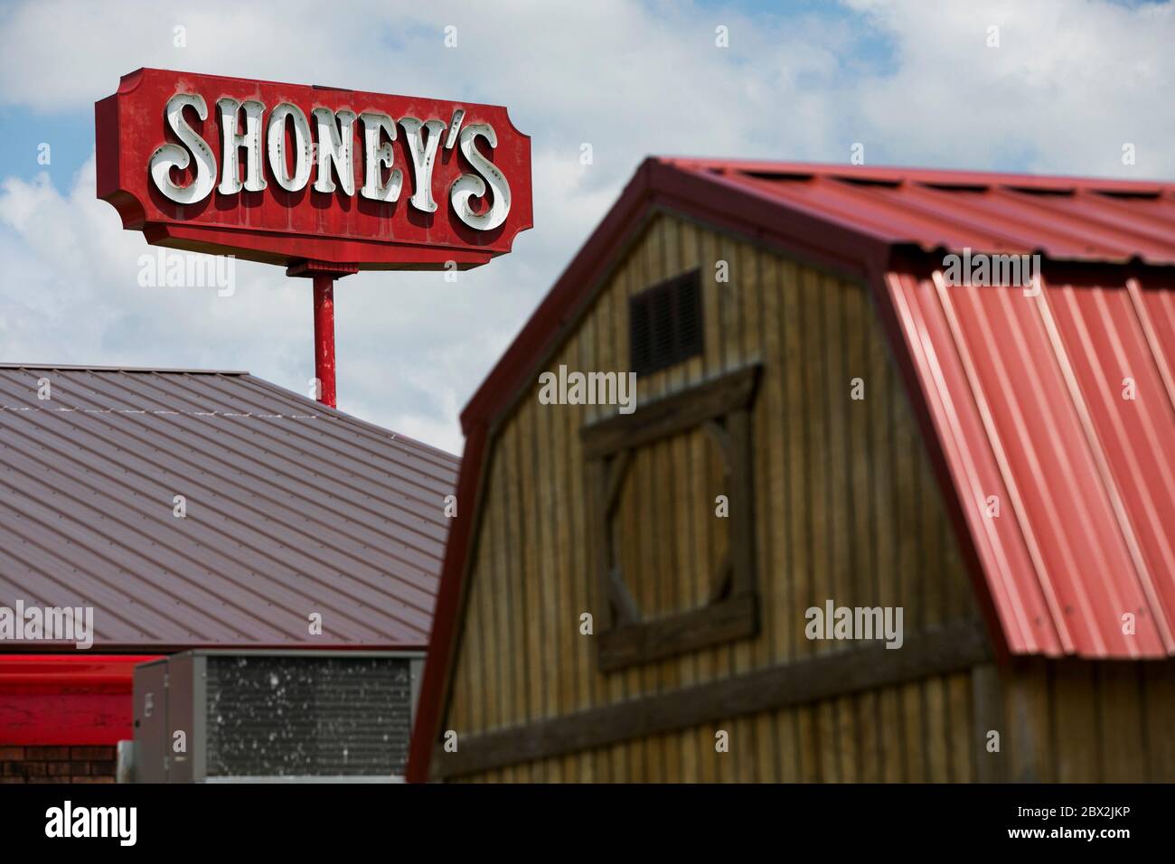 A logo sign outside of a Shoney's restaurant location in Sutton, West