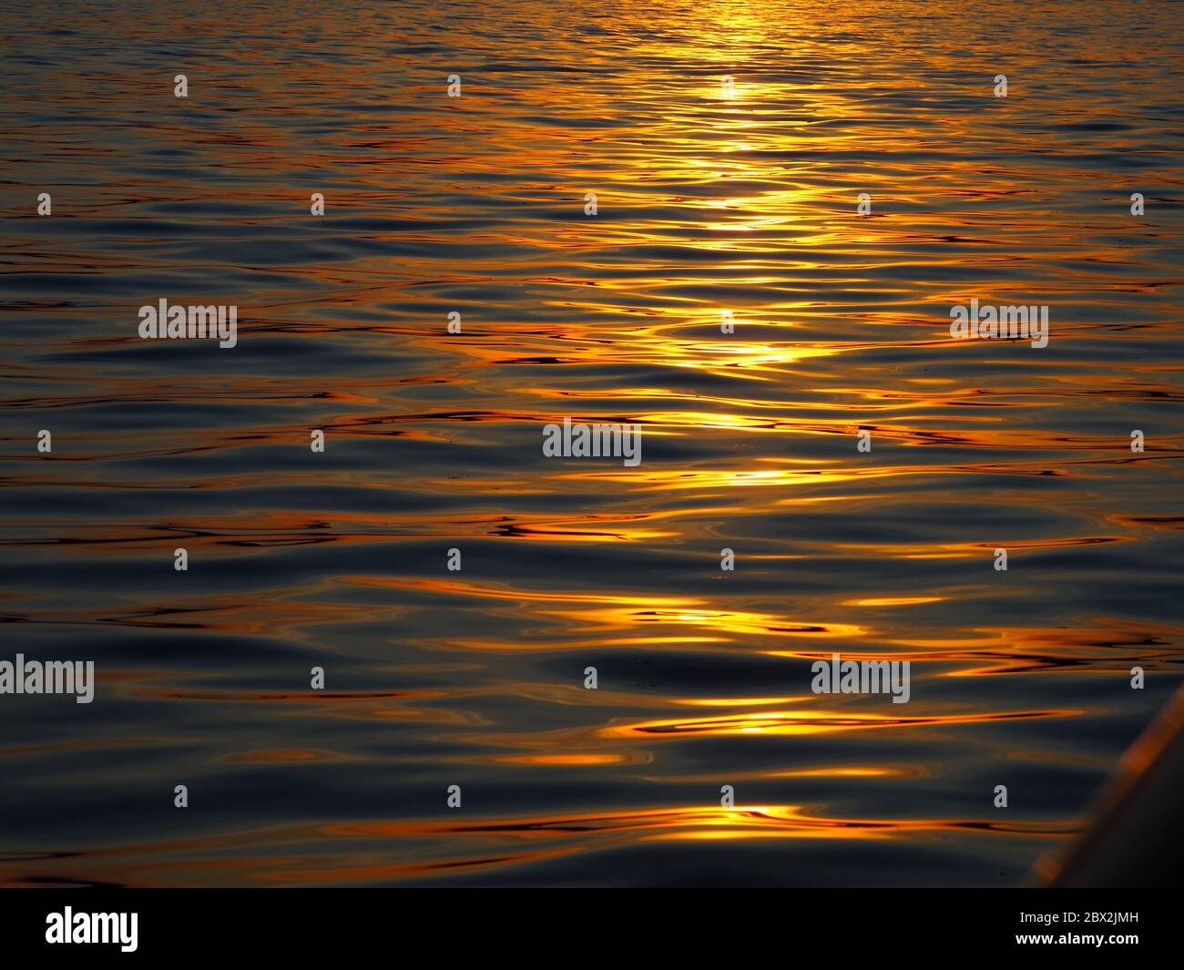 Sunlit Rippled Lake Water Abstract Stock Photo