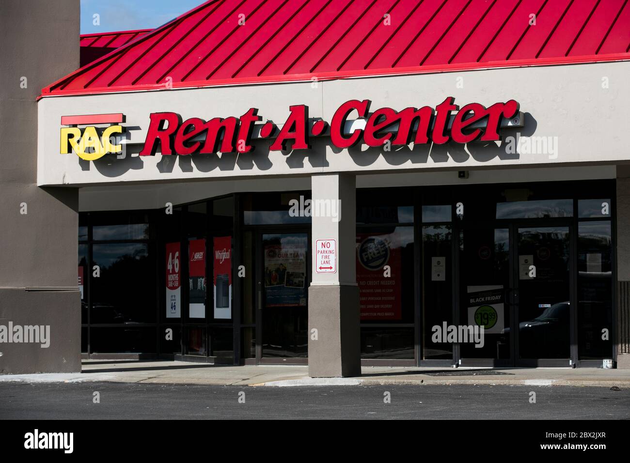 A logo sign outside of a RentACenter store location in
