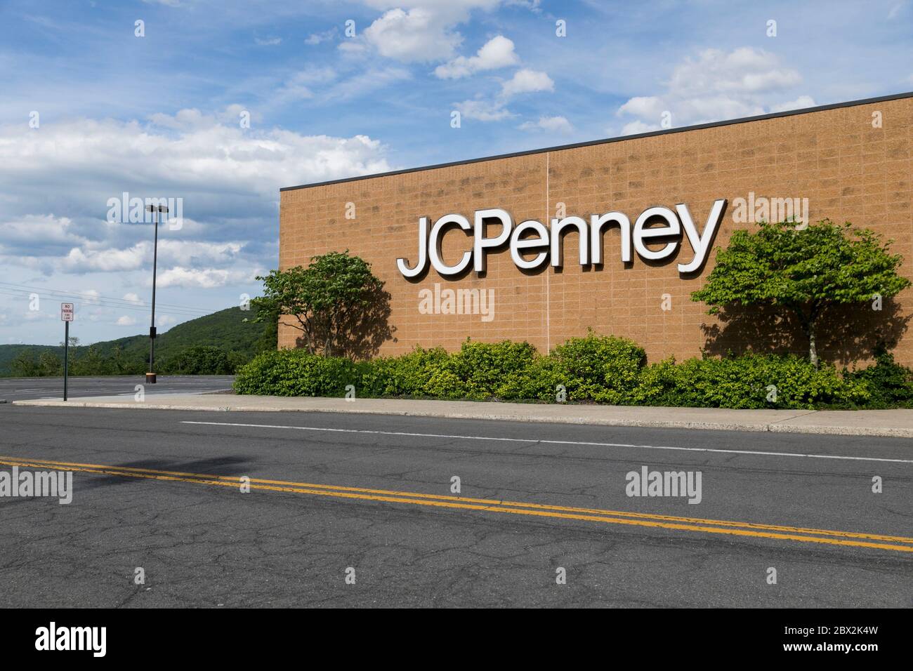 A logo sign outside of a JCPenney retail store location in Cumberland
