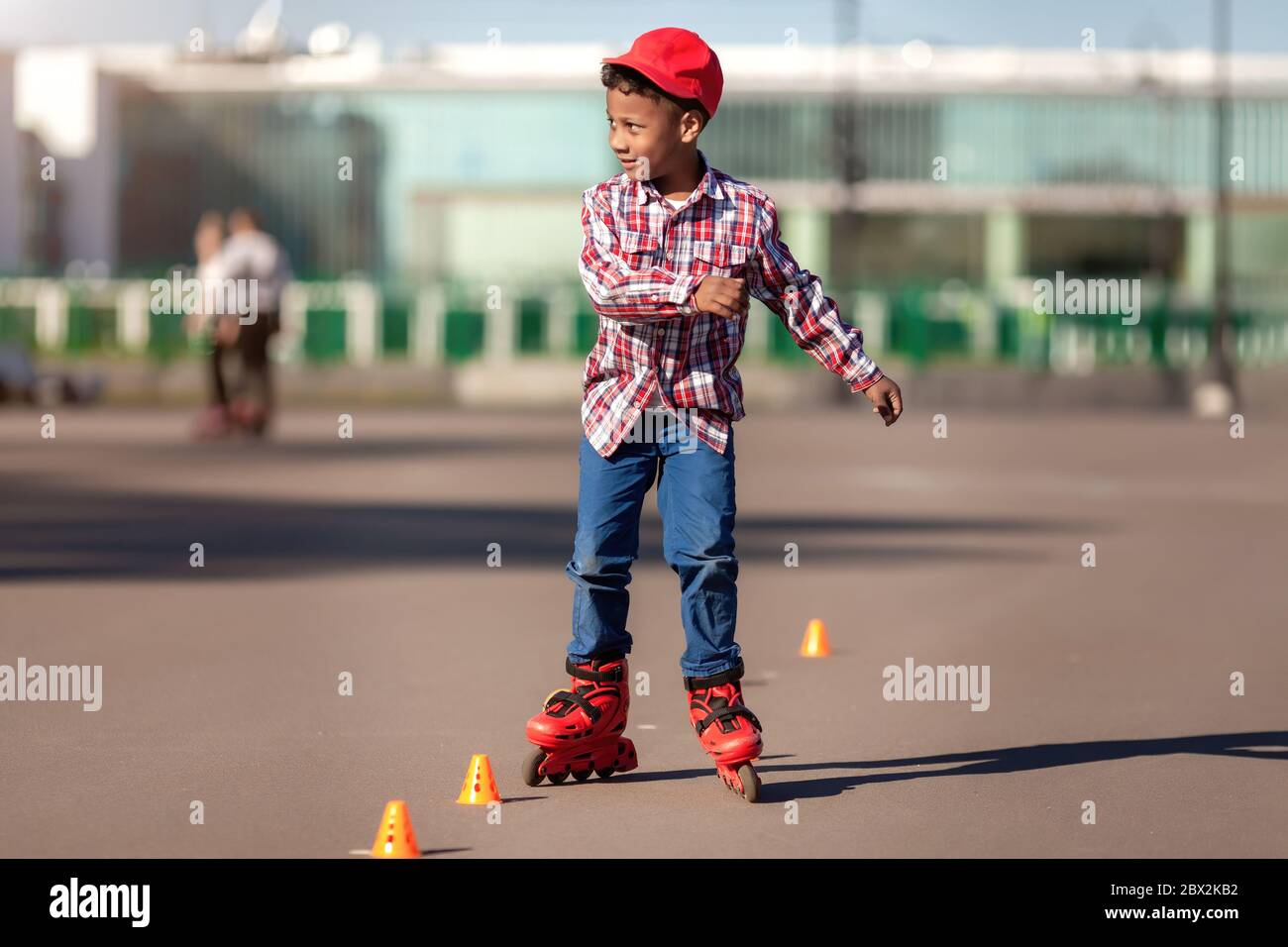 Kid roller skating in park hires stock photography and images Alamy